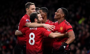 Anthony Martial (right) celebrates with teammates after scoring his teamâs second goal.