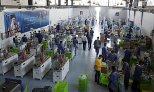 General view of a production line manufacturing face masks at a factory in Karaj, Iran, 28 June 2020.