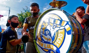 Fans of Atletico de San Luis play the drum as they cheer for their team before a Mexican Aperturna tournament football match against Monterrey, outside the Alfonso Lastras stadium in San Luis Potosi, Mexico, on 20 September 2020, amid the Covid-19 coronavirus pandemic.