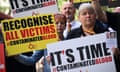 Protesters hold placards reading message related to the NHS infected blood scandal as Rishi Sunak is questioned by inflected blood inquiry in London on 26 July 2023