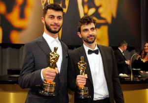 Basel Adra and Yuval Abraham pose with the Oscar for best documentary feature for No Other Land at the Governors Ball
