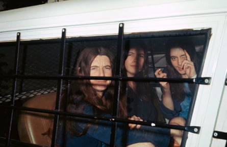three women sit in a car