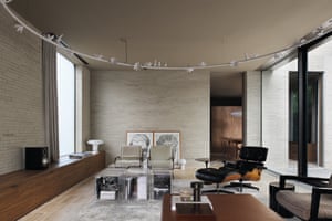 Living room with L-shaped oak cupboard and slim-lined concrete bricks