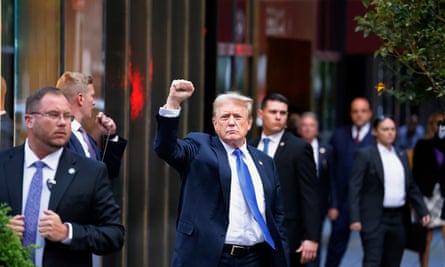 Donald Trump gestures to the crowd outside Trump Tower after the guilty verdicts