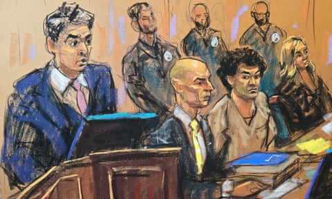 Victim Sunil Kavuri speaks at the podium as FTX founder Sam Bankman-Fried sits between his defense attorneys.