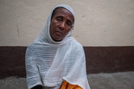 A woman wearing a white scarf
