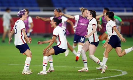 Megan Rapinoe celebrates with teammates after scoring the winning penalty against the Netherlands