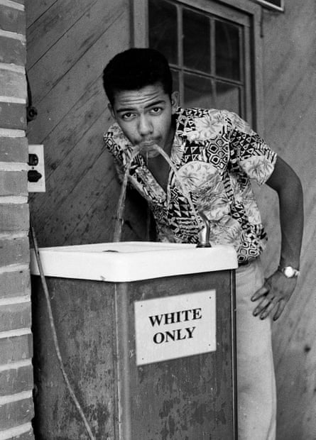 a young man drinking water
