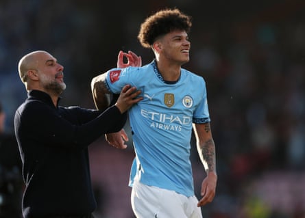 Manchester City manager Pep Guardiola and Nico O’Reilly at Bournemouth in March 2025.