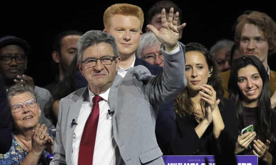 Mélenchon waves to supporters after his speech in Lille, northern France.
