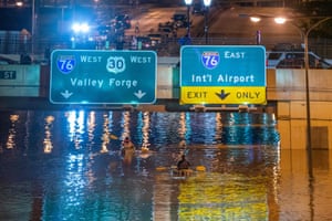 Kayakers paddle down Interstate 676 after flooding from heavy rains from hurricane Ida in Philadelphia