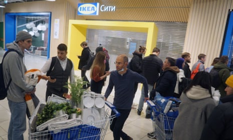 A shopper with his purchases push the trolley before he leaves the Ikea store in Moscow, Russia. Ikea is closing its stores and pausing all sourcing in Russia and Belarus from Friday.