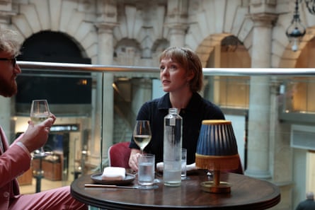 Samuel and Catrina chatting at a restaurant table
