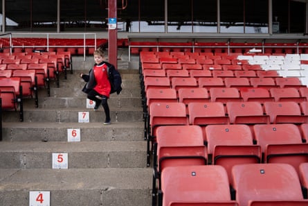 Ernest Hatton-Burrows runs down some stairs in one of the stands at the Bryne FK stadium.