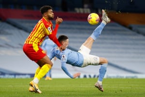 Manchester City’s Phil Foden attempts an overhead kick under pressure from West Bromwich Albion’s Darnell Furlong.