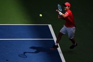 Yoshihito Nishioka hits a forehand from the baseline.