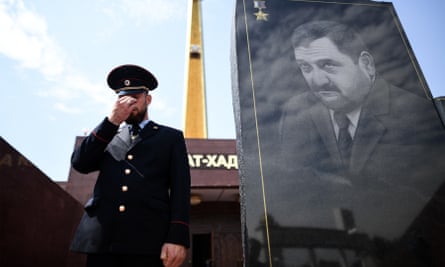 A police officer guards the memorial to Akhmad Kadyrov, the father of Ramzan Kadyrov, who was assassinated by Chechen Islamists in 2004.