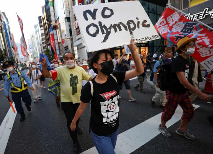 Anti-Olympics protestors march through Tokyo during the Games