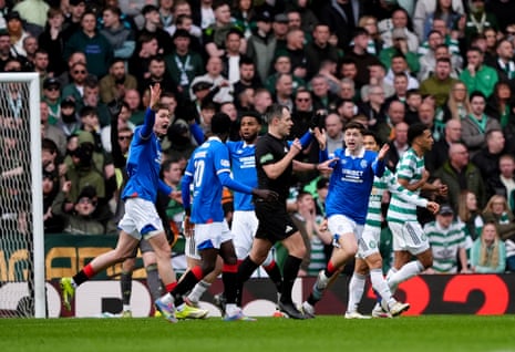 The Rangers players appeal for a handball but VAR says no.