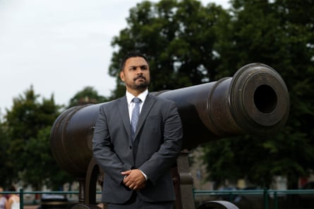 Andy George stood next to a cannon