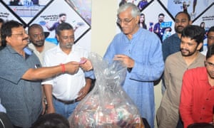 Chhattisgarh health minister, TS Singh Deo, right, brought half a kilo of plastic to the launch of the Garbage Cafe to emphasise that the scheme was for everyone.