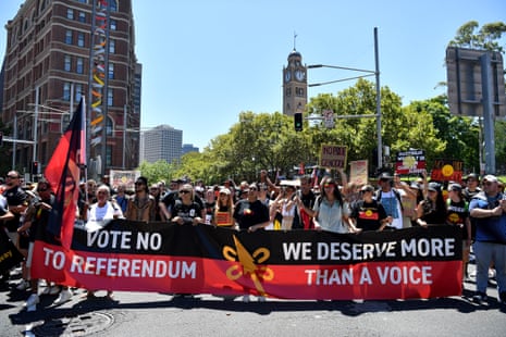 Demonstrators march in the Invasion Day rally in Sydney