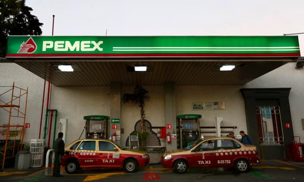 Taxis are seen at a Pemex gas station in Mexico City.