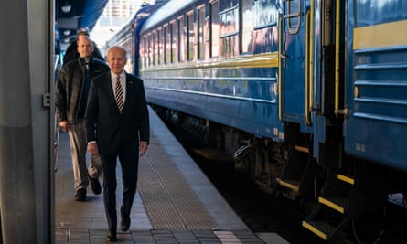 The US president, Joe Biden, walks along the train platform in Kyiv