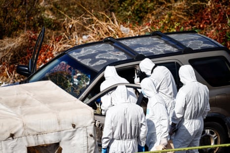 Forensic experts inspect the site following, what the health ministry says was an Israeli strike on a car, near Jounieh, north of Beirut, Lebanon, on Saturday.