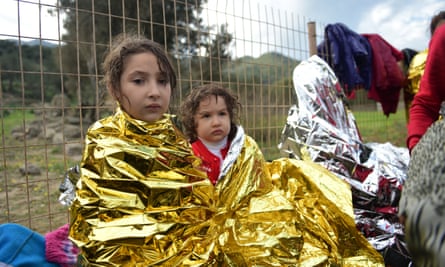 Newly-arrived children wait for humanitarian aid.