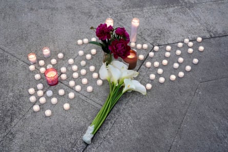 Candles and flowers on the ground