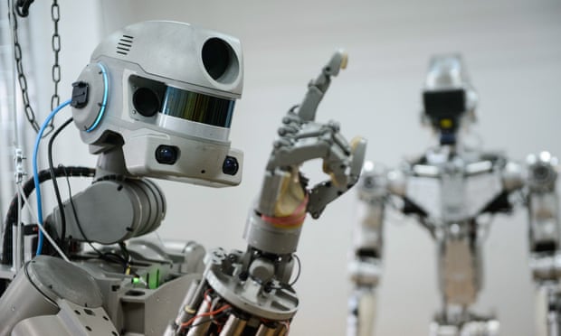 A robot prototype raises its hand