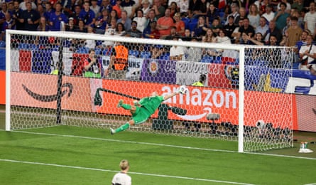 Ann-Katrin Berger launches herself backwards to claw away a deflected effort