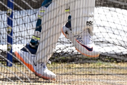 A dove symbol is seen on the shoe of Australia’s Usman Khawaja as he bats in the nets during a practice session.