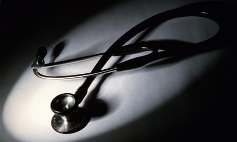 A black and white picture of a stethoscope among shadows