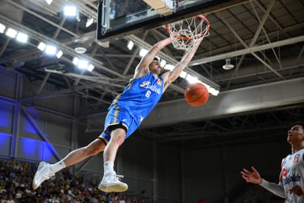 Tristan Devers of the Brisbane Bullets dunks during an NBL game last year.