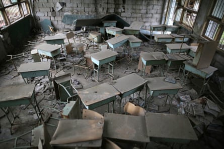Desks are seen in a classroom inside a destroyed building preserved following the 2008 Sichuan earthquake at Beichuan.