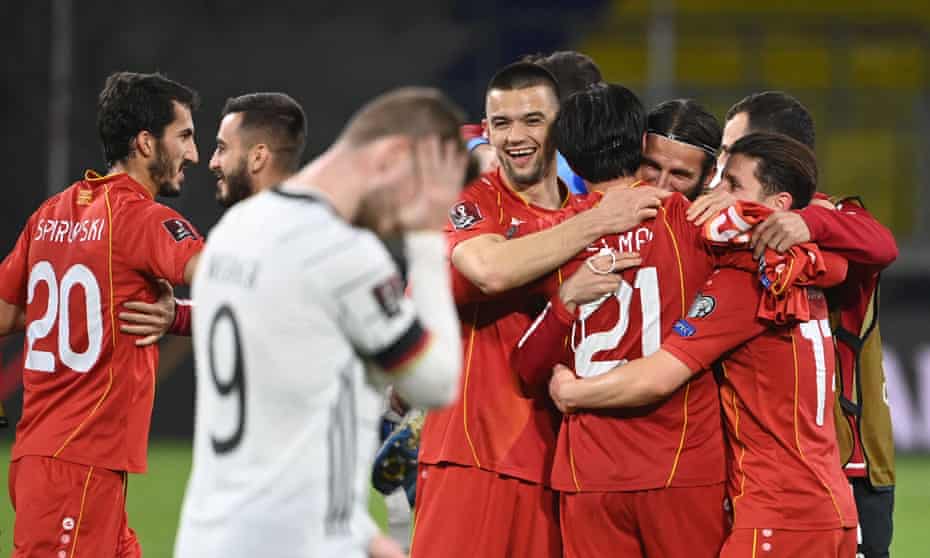 North Macedonia players embrace at full time after their shock 2-1 win over Germany.