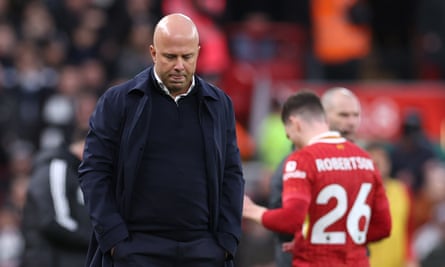 A disappointed Arne Slot reacts to Andy Robertson’s sending-off