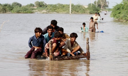 Displaced people flee their flooded homes in Pakistan, where floods have ravaged the country.