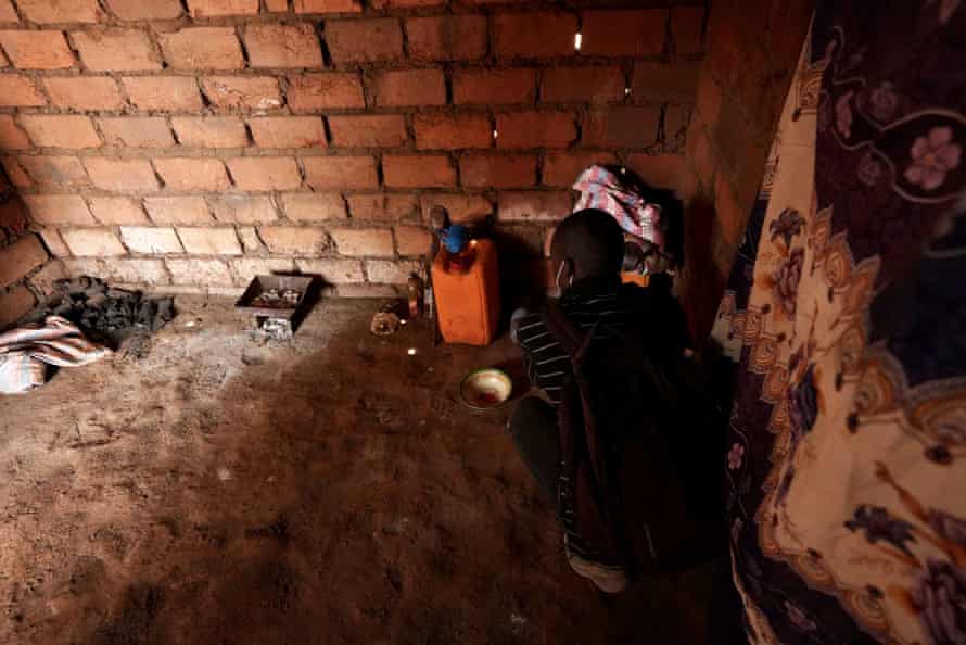 The bare, brick shack where a worker for one of the large industrial mines lives. He earns about £3.60 a day.