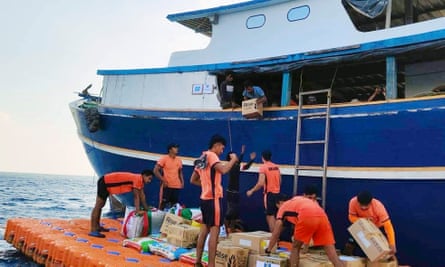 Supplies being unloaded from a fishing boat