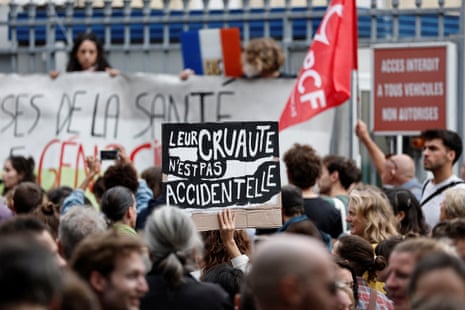 Protesters and caregivers on strike gather in front of the Tenon hospital during a day of protests in Paris as part of the ‘block everything’ protest movement. The slogan on the placard reads ‘Heir cruelty is not accidental’.