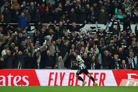 Newcastle United's Harvey Barnes celebrates scoring their first goal in front of their joyous fans.