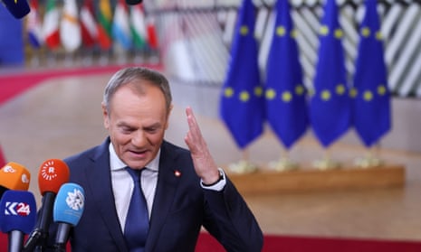 Polish Prime Minister Donald Tusk speaks to the press as he attends a European Union summit in Brussels.