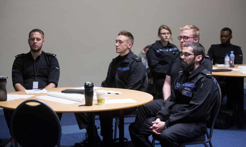 Bedfordshire police staff taking part in a meditation class.