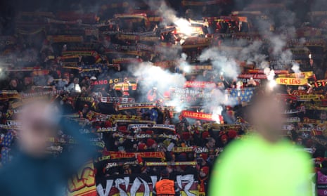 RC Lens fans with flares inside the stadium before the match.