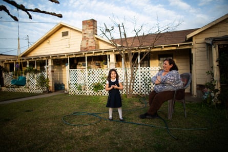Jovita Torres (right), who has lived in her house she rents in Tombstone Territory (an unincorporated working class neighborhood 20 minutes south east of Fresno) for 30 years, in her garden with her 3.5 year old granddaughter Alessandra California, February 21st, 2020.