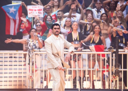 Bad Bunny delights fans near the stage barrier.