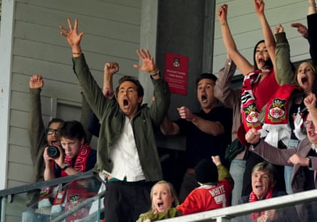 Ryan Reynolds and Rob Mac throw their hands in the air and go wild after Wrexham score